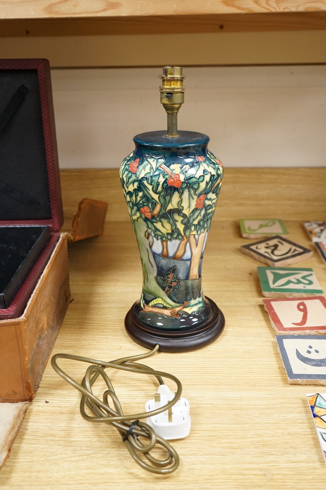 A Moorcroft lamp base decorated in the Holly Hatch pattern, 37cm high including the fitting